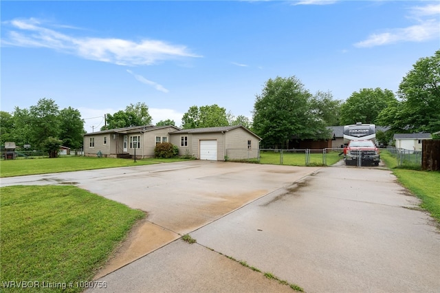 605 6th St, Barling, AR 72923 - view of front facade featuring a garage, a front lawn, fence, and driveway