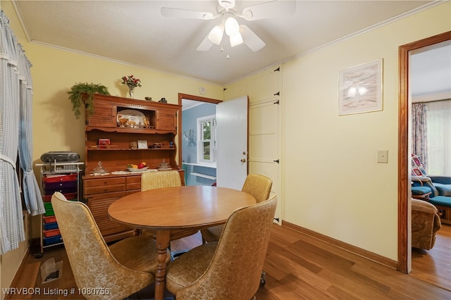605 6th St, Barling, AR 72923 - dining room with crown molding, baseboards, a ceiling fan, and wood finished floors