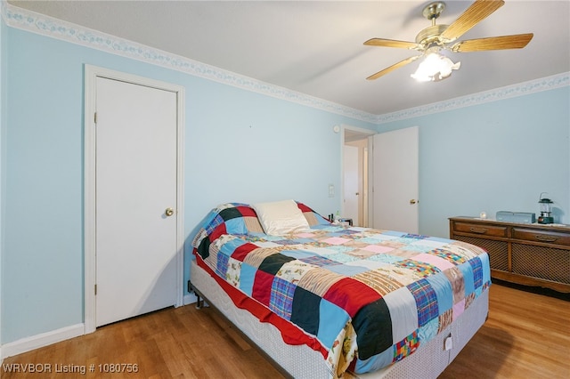 605 6th St, Barling, AR 72923 - bedroom with ceiling fan and wood finished floors