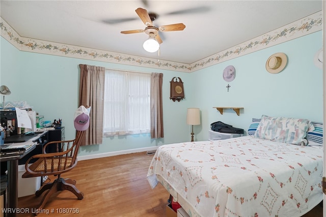 605 6th St, Barling, AR 72923 - bedroom featuring baseboards, ceiling fan, and wood finished floors