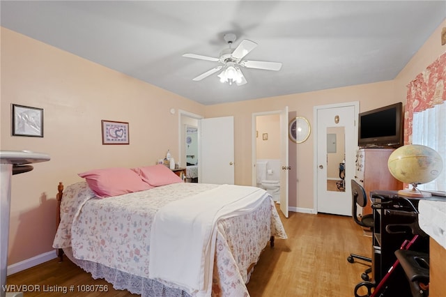 605 6th St, Barling, AR 72923 - bedroom with baseboards, ensuite bathroom, and wood finished floors
