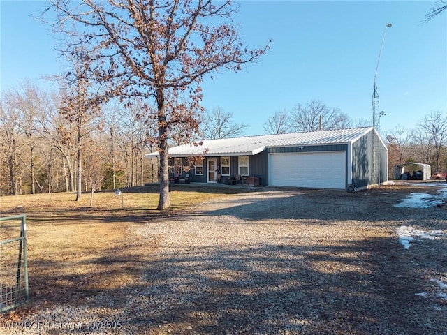 ranch-style house with a porch and a garage