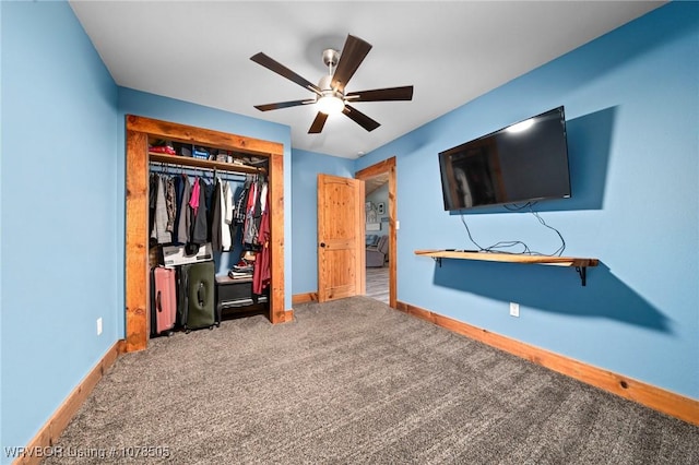 unfurnished bedroom featuring ceiling fan, a closet, carpet flooring, and baseboards