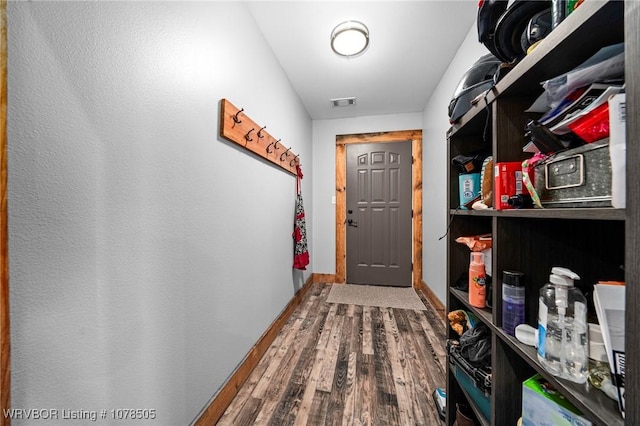 doorway to outside featuring wood-type flooring