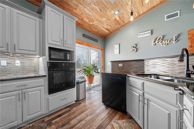 kitchen with black appliances, wooden ceiling, tasteful backsplash, sink, and vaulted ceiling