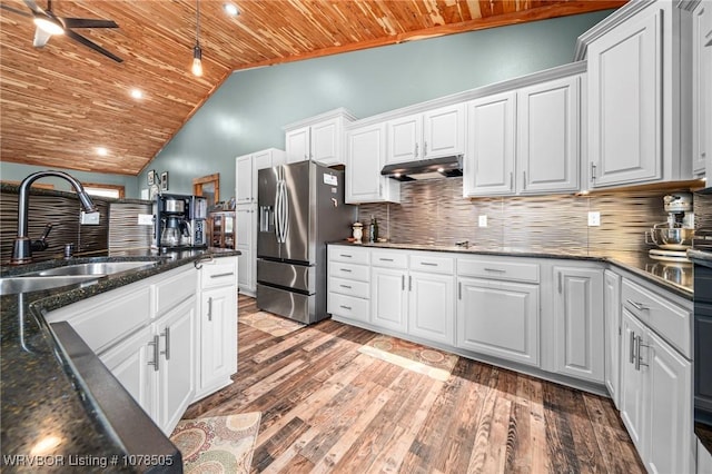 kitchen featuring white cabinets, backsplash, wooden ceiling, and stainless steel fridge with ice dispenser