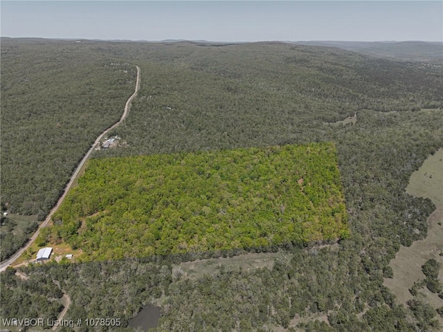 aerial view featuring a forest view