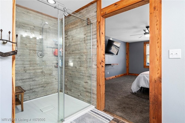 bathroom featuring ceiling fan and walk in shower