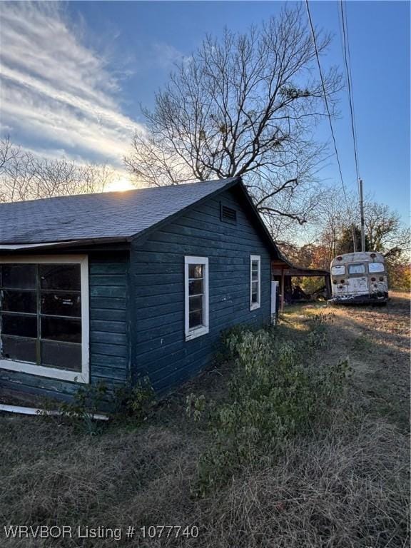 view of property exterior at dusk