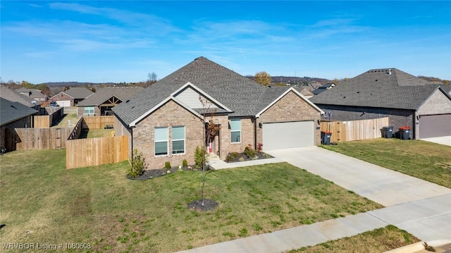 3912 Kent Ln, Springdale, AR 72764 - view of front of house featuring fence, an attached garage, brick siding, and driveway