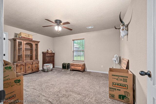 1917 Fisher Rd, Muldrow, OK 74948 - sitting room featuring a ceiling fan, a textured ceiling, carpet floors, and baseboards