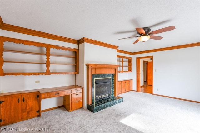 living room featuring ceiling fan, light colored carpet, ornamental molding, and a tile fireplace