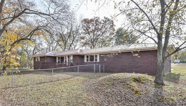 back of property featuring a wooden deck