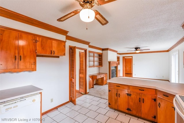 kitchen featuring a textured ceiling, white appliances, ceiling fan, crown molding, and light tile patterned floors