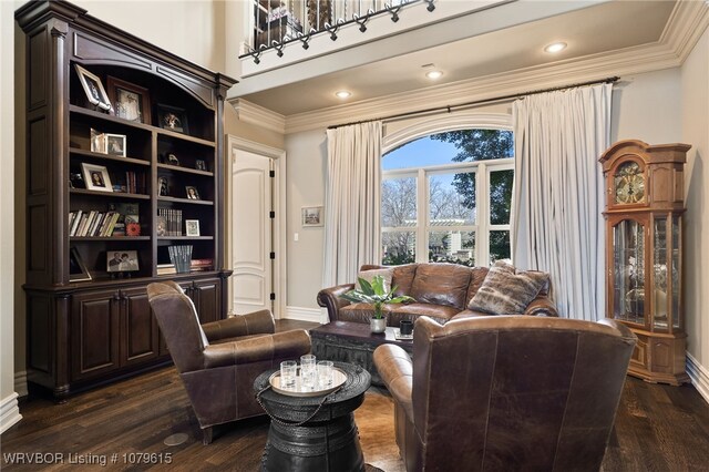 living area featuring dark wood finished floors, recessed lighting, baseboards, and ornamental molding