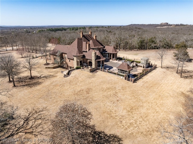 birds eye view of property with a rural view