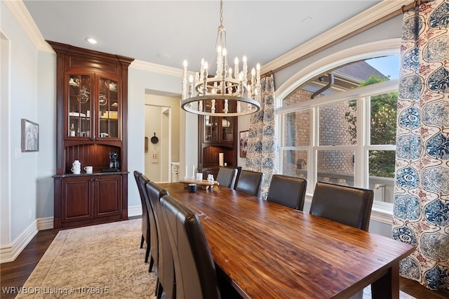 dining room with dark wood-type flooring, baseboards, a chandelier, ornamental molding, and recessed lighting