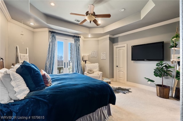 carpeted bedroom featuring visible vents, a raised ceiling, french doors, baseboards, and access to exterior