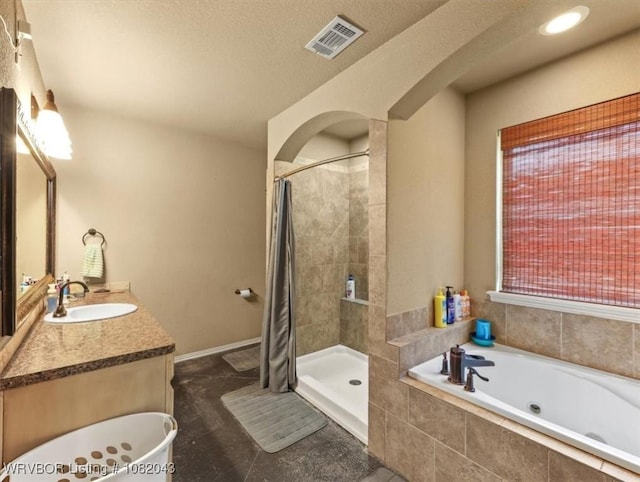 1112 Persimmon St, Greenwood, AR 72936 - full bath with a jetted tub, tiled shower, vanity, and a textured ceiling