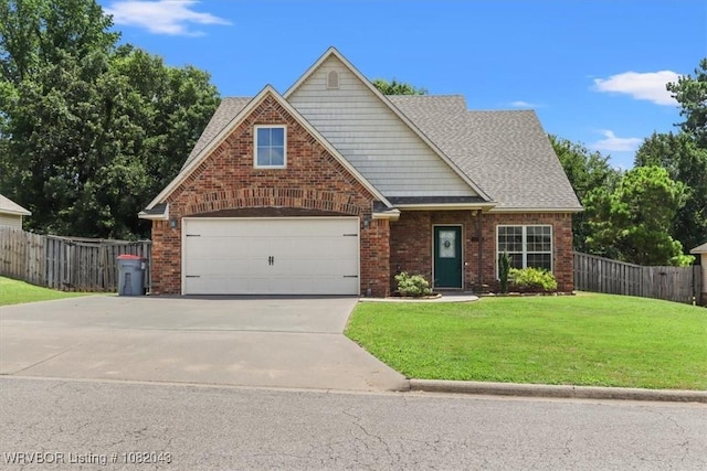 1112 Persimmon St, Greenwood, AR 72936 - traditional-style house with driveway, roof with shingles, an attached garage, and brick siding