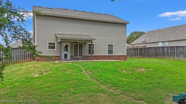 1112 Persimmon St, Greenwood, AR 72936 - back of property featuring ceiling fan, a fenced backyard, and brick siding