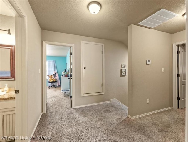 1112 Persimmon St, Greenwood, AR 72936 - corridor with carpet flooring and a textured ceiling