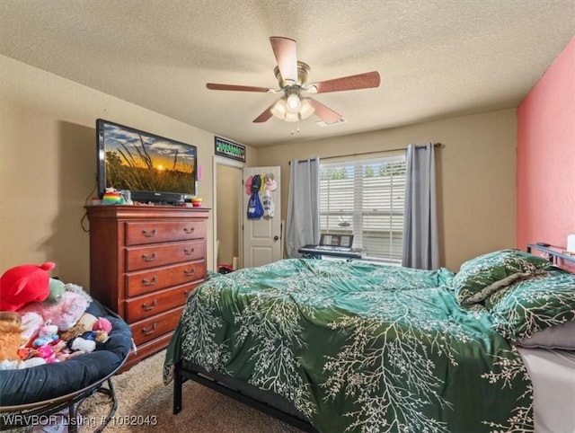 1112 Persimmon St, Greenwood, AR 72936 - carpeted bedroom featuring a textured ceiling and ceiling fan