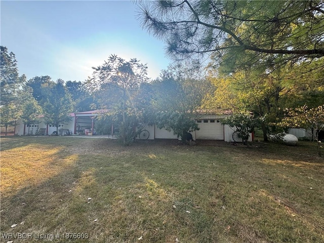 view of yard featuring a garage