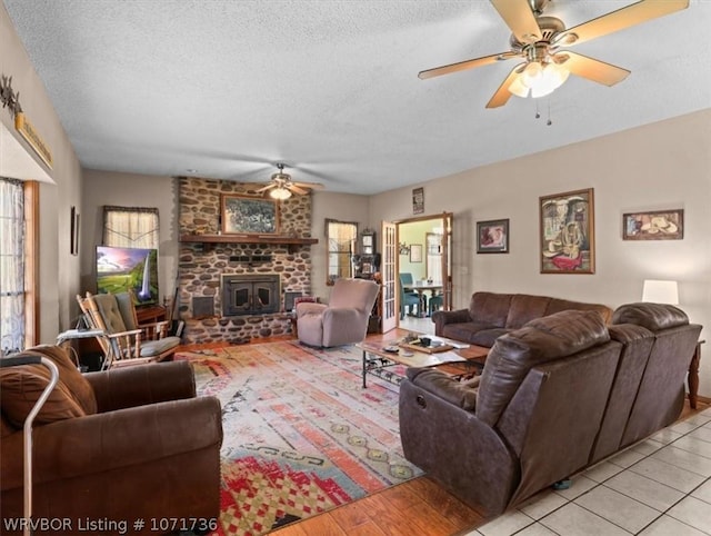 87387 S 4719, Stilwell, OK 74960 - living room with ceiling fan, light tile patterned flooring, and a textured ceiling