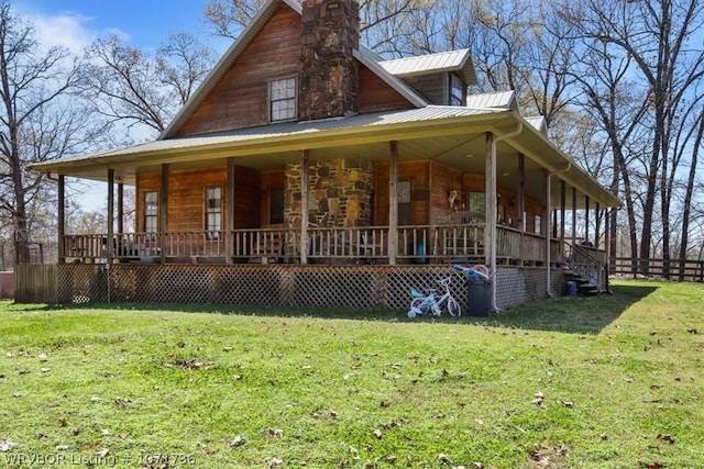 view of home's exterior featuring covered porch and a yard