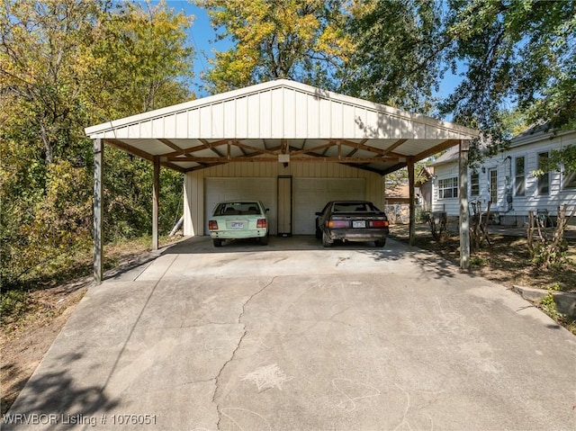 view of car parking featuring a garage and a carport