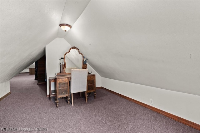 office with carpet and vaulted ceiling