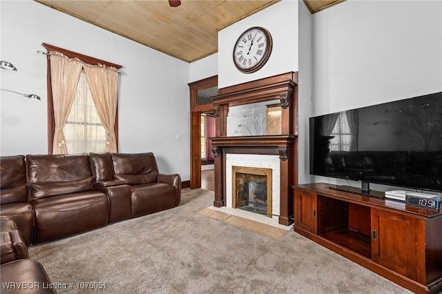 carpeted living room with lofted ceiling and wood ceiling