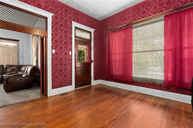 unfurnished room featuring hardwood / wood-style floors