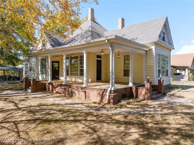 rear view of house with a porch and ceiling fan