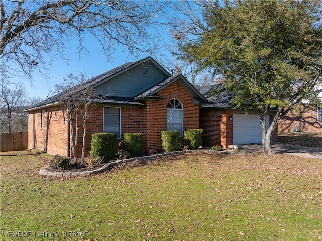 view of front of house featuring a front yard and a garage