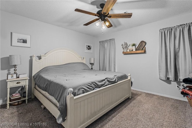 bedroom featuring ceiling fan, a textured ceiling, and dark colored carpet