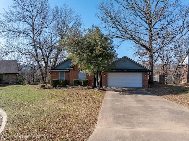 view of front of house with a garage and a front lawn