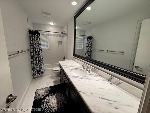 full bathroom featuring toilet, tile patterned flooring, visible vents, and vanity