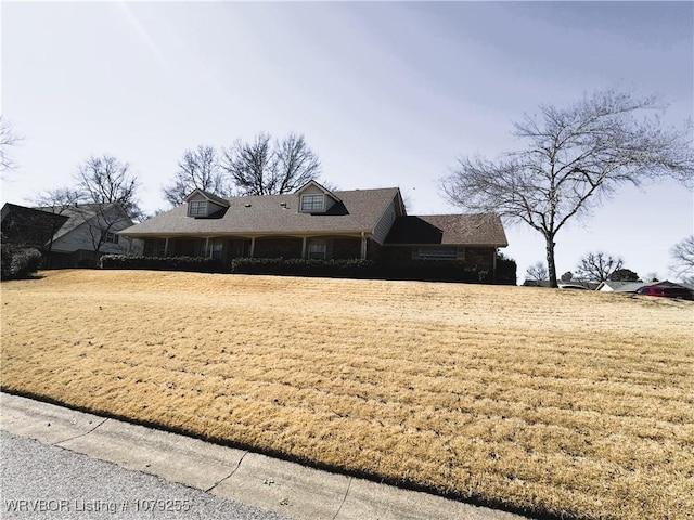 view of side of home featuring a lawn