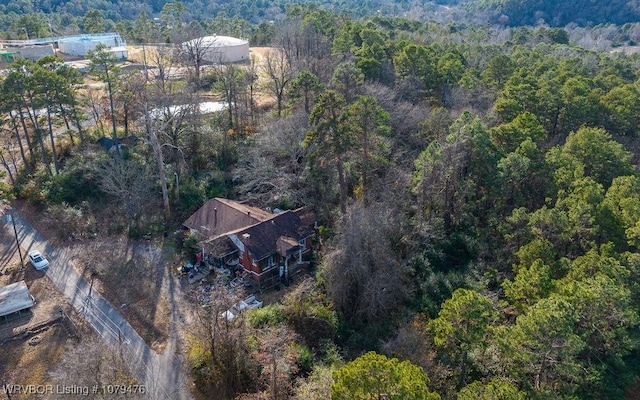 drone / aerial view featuring a forest view