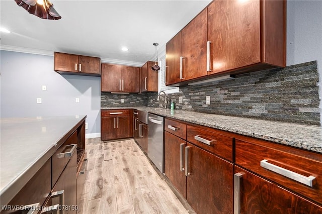 kitchen featuring light wood-type flooring, light stone counters, ornamental molding, pendant lighting, and dishwasher