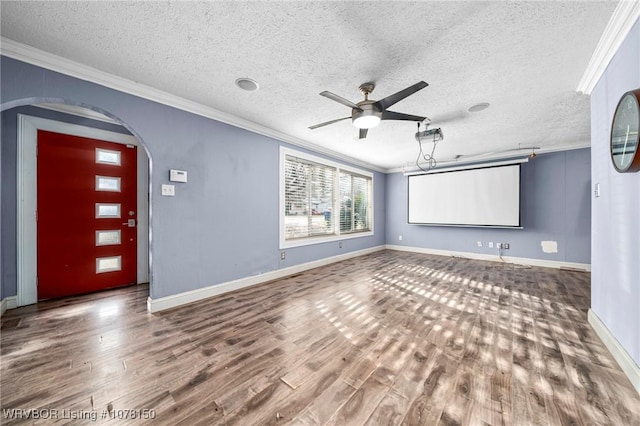 foyer featuring crown molding, hardwood / wood-style floors, ceiling fan, and a textured ceiling