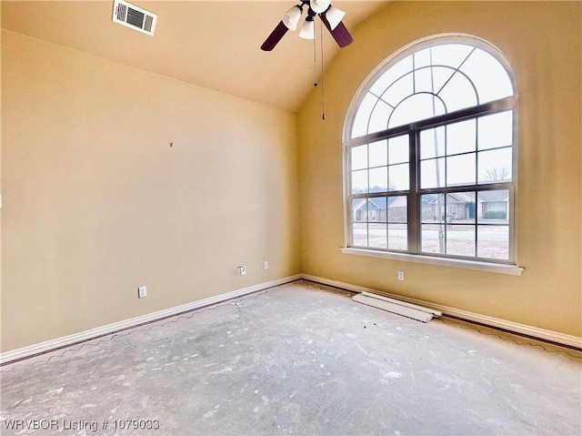 empty room featuring ceiling fan and vaulted ceiling