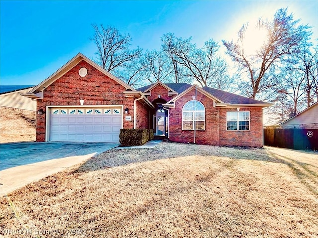 view of front facade featuring a garage and a front lawn