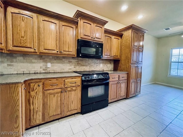 kitchen with light tile patterned flooring, decorative backsplash, and black appliances