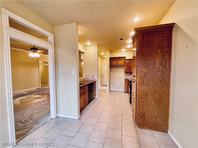 kitchen featuring ceiling fan, light tile patterned floors, and dishwasher