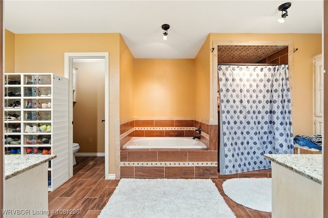 1524 Bunker Hill Ct, Van Buren, AR 72956 - full bath featuring toilet, a bath, wood finished floors, vanity, and curtained shower