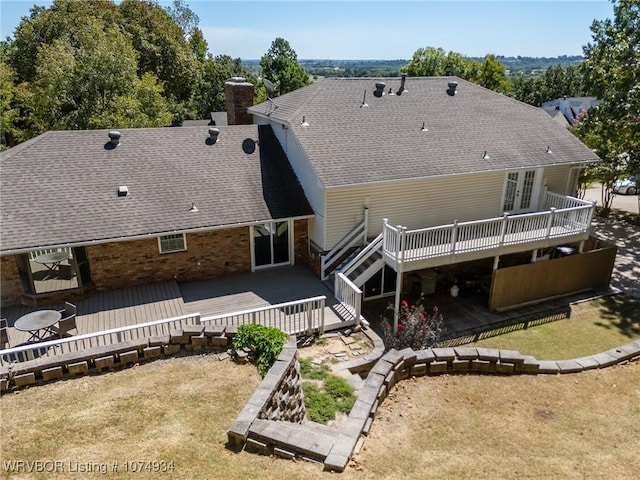 back of property featuring french doors and a deck