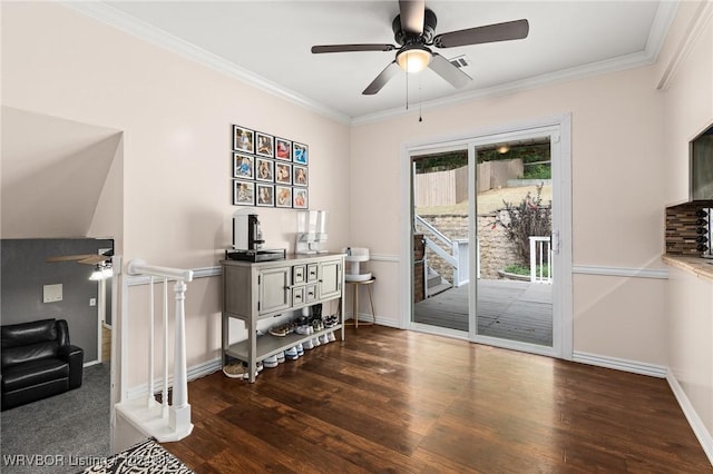 interior space featuring dark hardwood / wood-style floors, ceiling fan, and crown molding